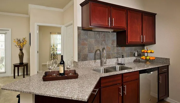Apartment kitchen with granite Sandalwood Village | Naples FL