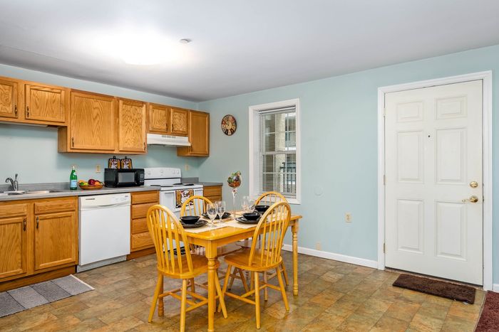 Spacious Dining Area with Window and Appliances