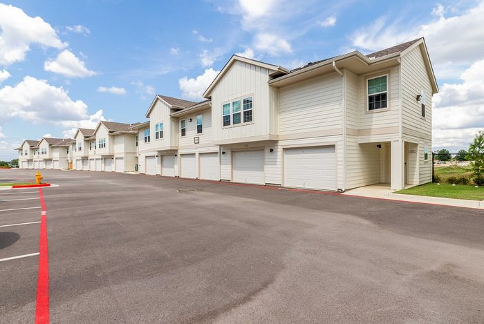 Apartment Building with Garages at The Laurels Apartments in Jenks, OK