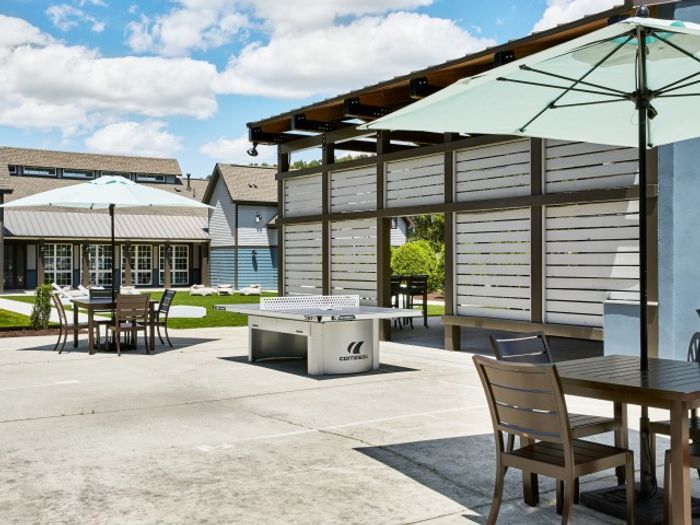 Outdoor sun lounge and game area at The Flatts Salisbury