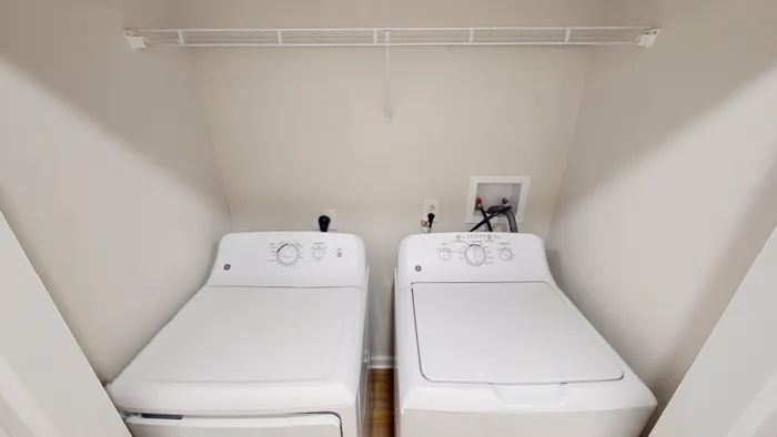 An in-unit washer and dryer setup at Ralston Apartments in Downtown Indianapolis, offering residents the convenience of doing laundry at home.