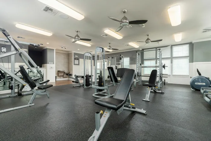 Fully equipped fitness center with modern machines at Seaglass Apartments in Corpus Christi.