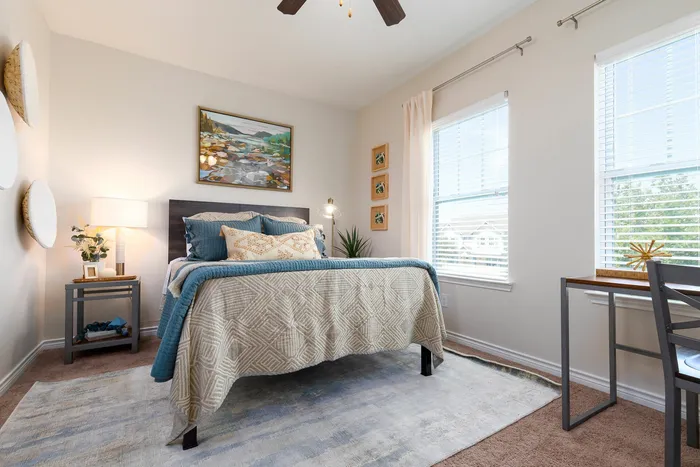 Bright and cozy bedroom with natural light and stylish decor at Seaglass Apartments in Corpus Christi