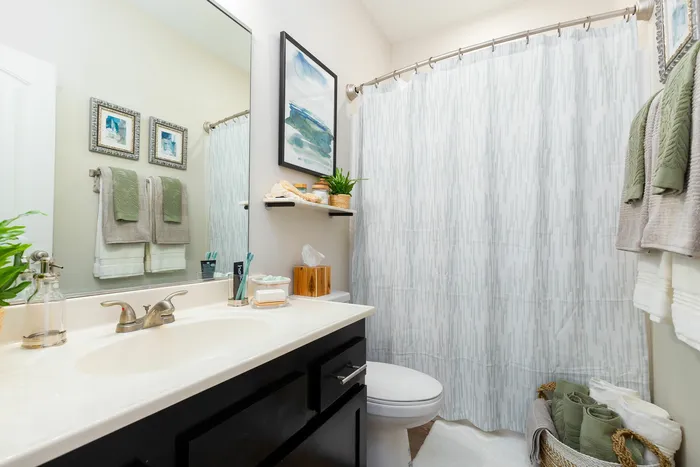Modern bathroom with stylish decor and vanity at Seaglass Apartments in Corpus Christi