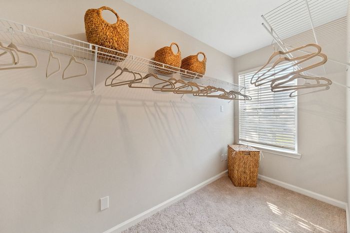 Huge walk-in closet with a window