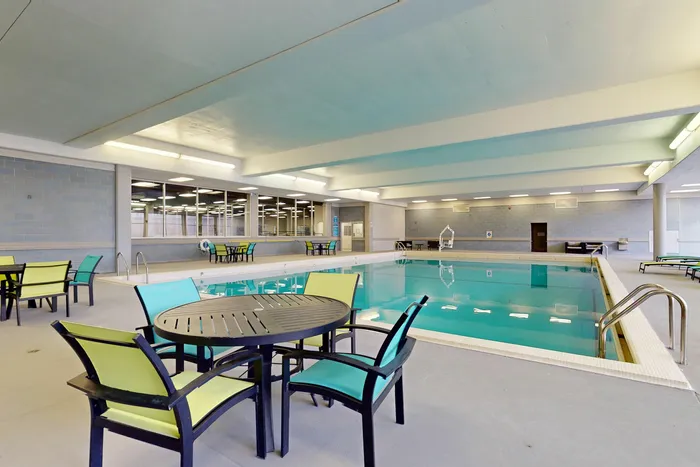 Inviting indoor pool and spacious deck area in University Plaza off-campus student apartments near NIU