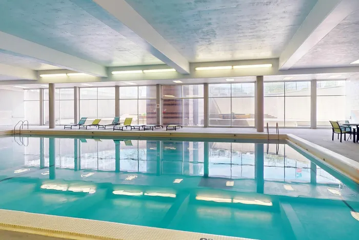 Inviting indoor pool for relaxation and recreation at University Plaza student apartments near NIU