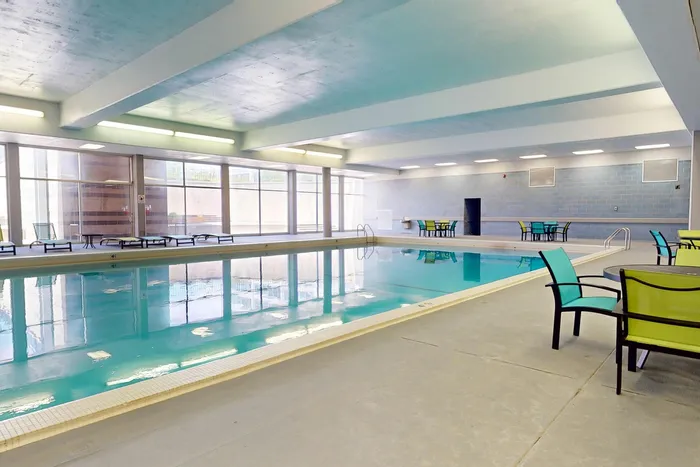 Inviting indoor pool for relaxation and recreation at University Plaza student apartments near NIU