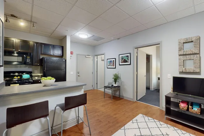 Spacious open floor plan in fully furnished student apartments at University Plaza near NIU