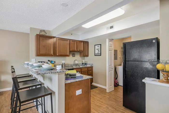 Kitchen featuring granite countertops and black appliances