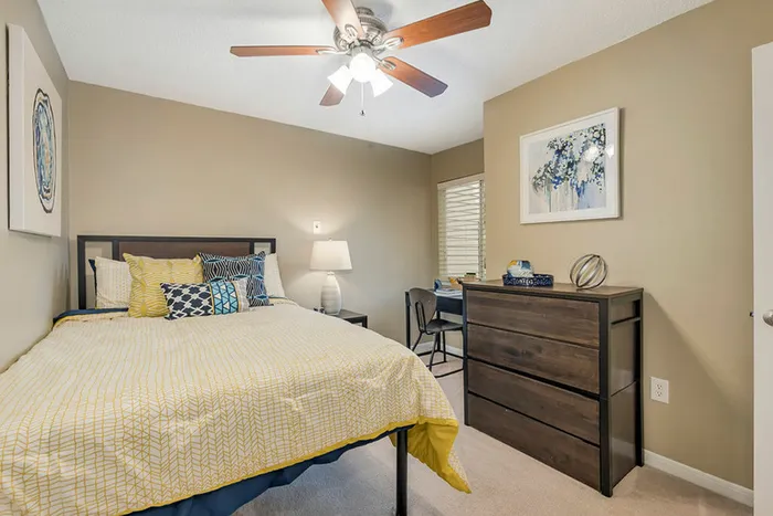 Bedroom featuring a ceiling fan with light kit