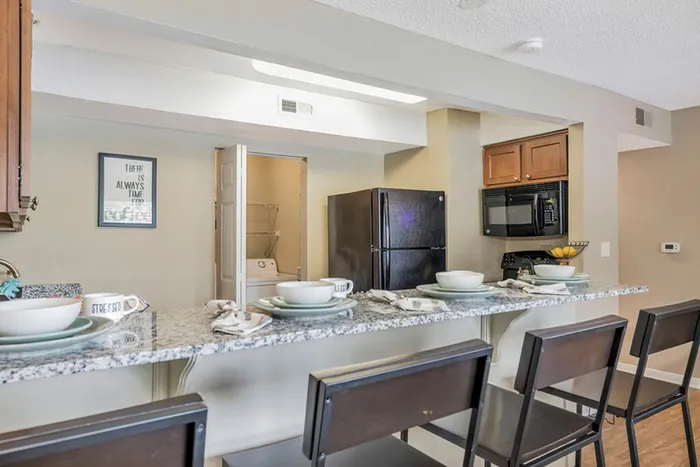 Kitchen featuring granite countertops and a breakfast bar