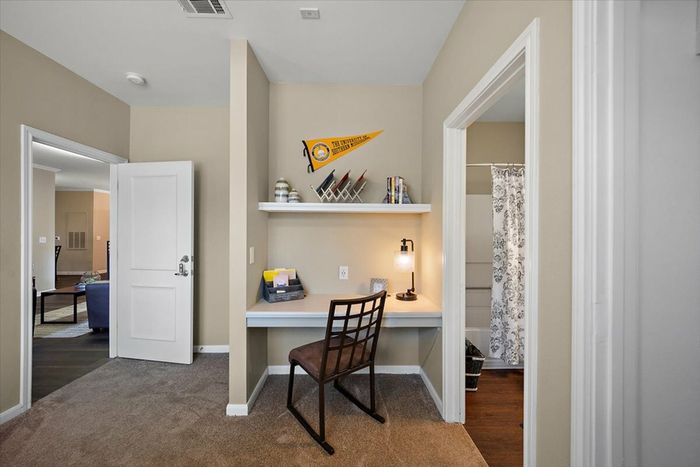 Built-in desk with shelving in a bedroom at Eagle Flatts Student Apartments in Hattiesburg, MS.