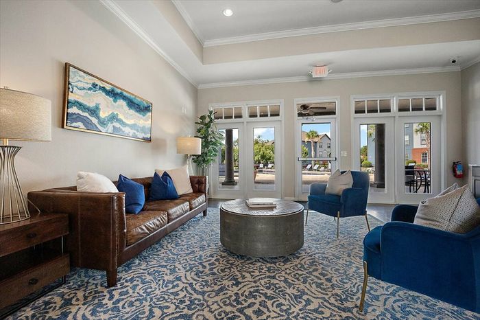 Stylish and cozy clubhouse lounge at Eagle Flatts Apartments in Hattiesburg, MS with comfortable seating and decor.