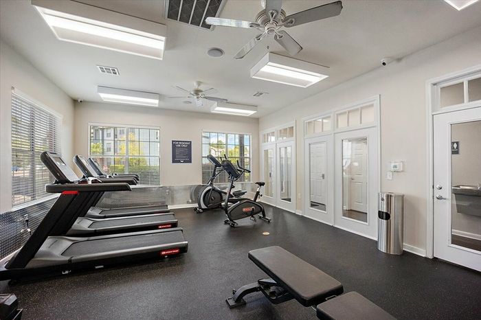 State-of-the-art fitness center at Eagle Flatts Apartments in Hattiesburg, MS with cardio and strength training equipment.
