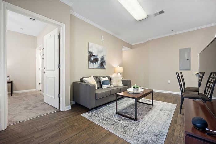 Cozy living room with modern decor at Eagle Flatts Student Housing in Hattiesburg, MS.