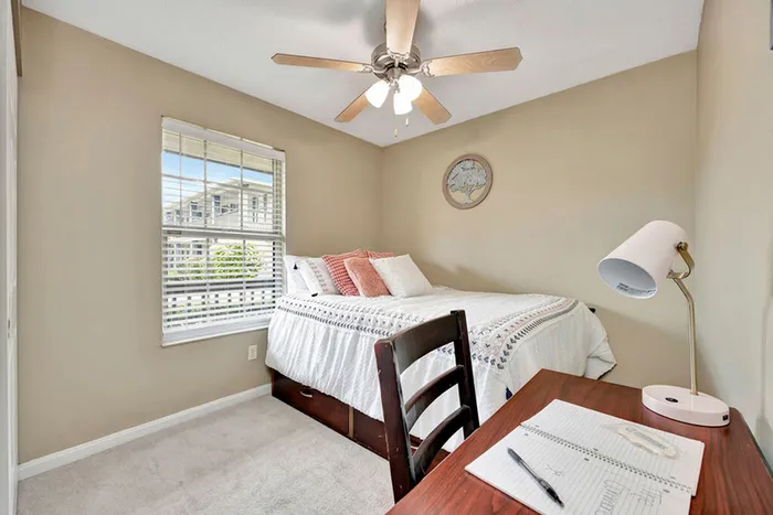 Bedroom with desk area, spacious closet and light kit at The Commons student apartments in Oxford, OH