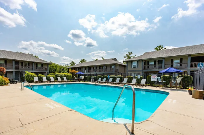 Sparkling swimming pool and lounge area at The Commons student apartments in Oxford, OH