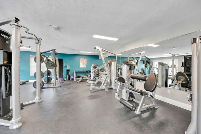 Running machine, stair stepper, and cycling machine in the fitness center at The Commons student apartments in Oxford, OH