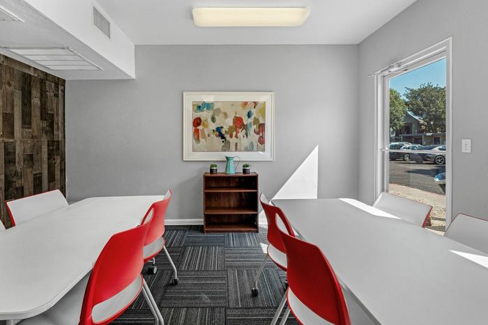 Quiet study lounge at Raiders Walk with desks, chairs, and plenty of natural light