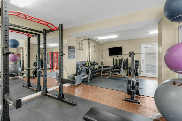 Weight lifting at Raiders Walk with ample room, yoga balls, and mats for residents to practice and relax