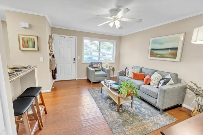 Cozy living room with stylish decor and natural lighting at Eagles West Apartments in Auburn, AL.