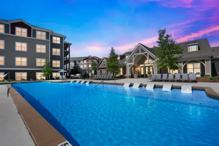 Resort-style pool and clubhouse at The Flatts Starkville student apartments near MSU.