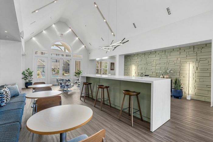 Stylish resident lounge with modern seating at The Flatts Starkville student apartments near MSU.
