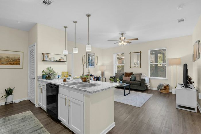 Spacious kitchen and living room area in an open-concept floor plan at The Flatts Starkville near MSU.