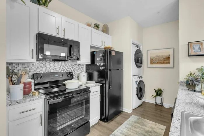 Spacious kitchen and living room area in a student apartment at The Flatts Starkville near MSU.