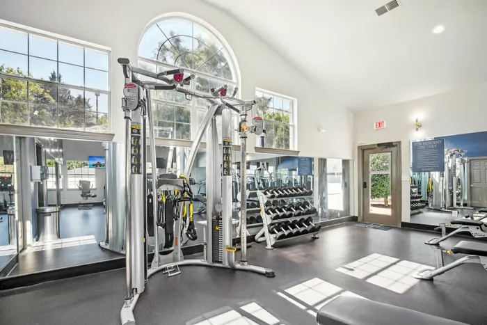 Fully equipped fitness center with strength training machines and cardio equipment at The Preserve Murfreesboro.