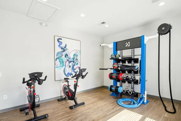 Indoor yoga studio with stationary bikes, exercise balls, and free weights at The Preserve Murfreesboro.