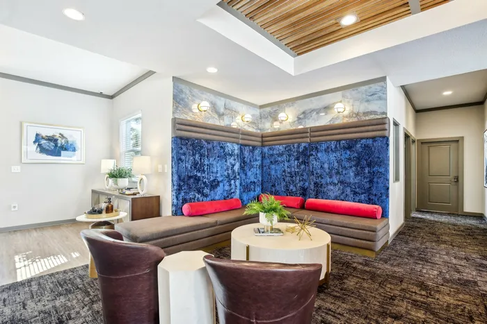 Cozy lounge area with vibrant seating and large windows at The Preserve Murfreesboro.