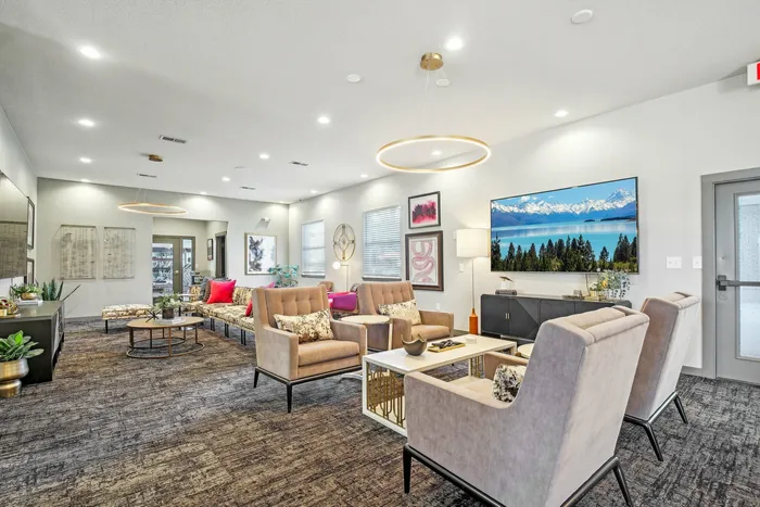 Stylish resident lounge with modern decor, comfortable seating, and vibrant accents at The Preserve Murfreesboro.