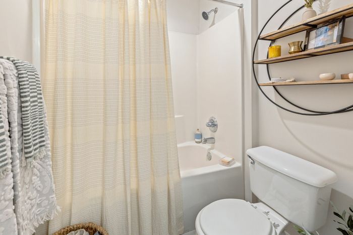 Bright bathroom with lots of space at Theater Street Apartments in Lafayette, LA