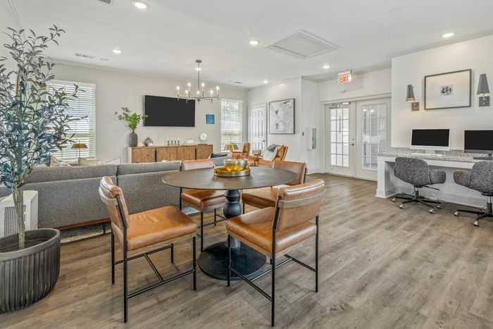 Modern business room with computer equipment and printer at Theater Street Apartments in Lafayette, LA