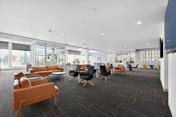 Spacious and inviting lobby area with stylish seating, modern decor, and ample natural light, perfect for welcoming guests and making lasting impressions.
