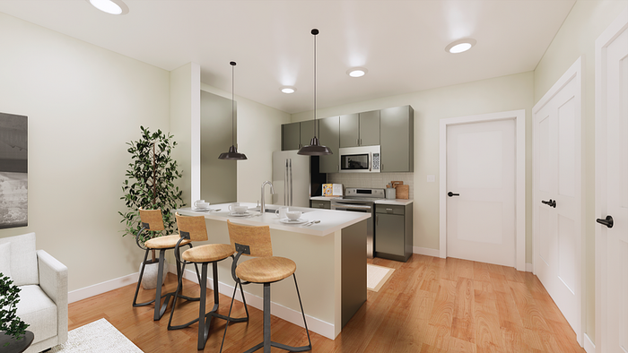 Sleek modern kitchen with stainless steel appliances, a cozy breakfast bar, and elegant pendant lighting.