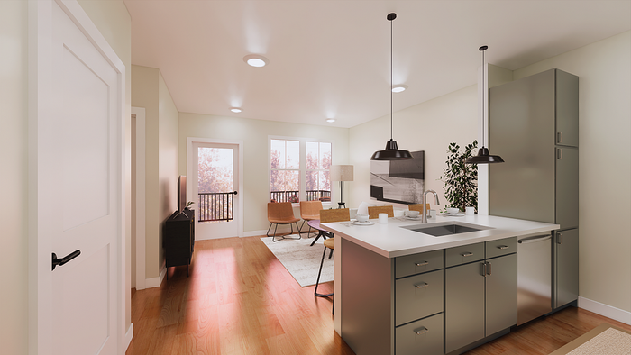 Modern open-concept living space featuring a sleek kitchen island, cozy living area, and abundant natural light from large windows.