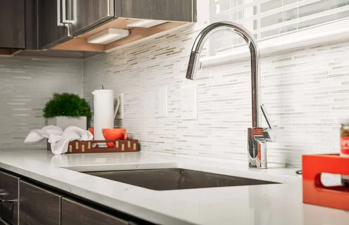 Close-up of Sink in Prep-friendly Kitchen at Greenhouse; Apartments In Houston