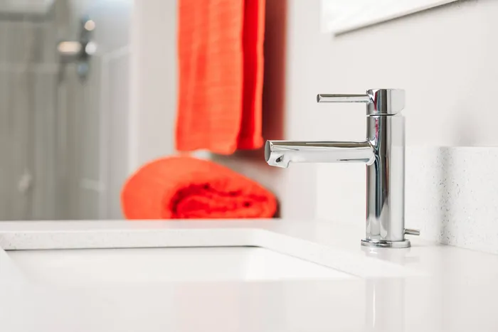 Close-up of Sink in Conventional Bathroom and Greenhouse; Best Apartments In Houston