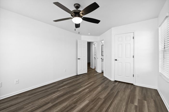 Renovated Apartment - Wood-plank flooring, sliding doors, ceiling fan in bed room at  | The Residence at Turnberry | Columbus Apartments