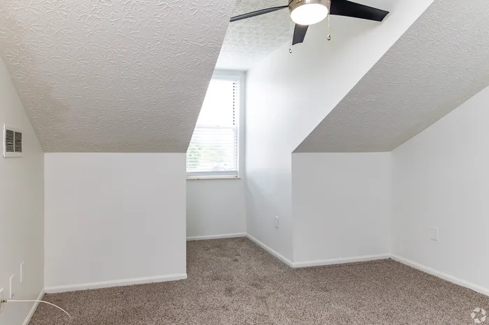 Aspire Apartment Homes | Canal Winchester, OH | Carpeted Room w/ Ceiling Fan