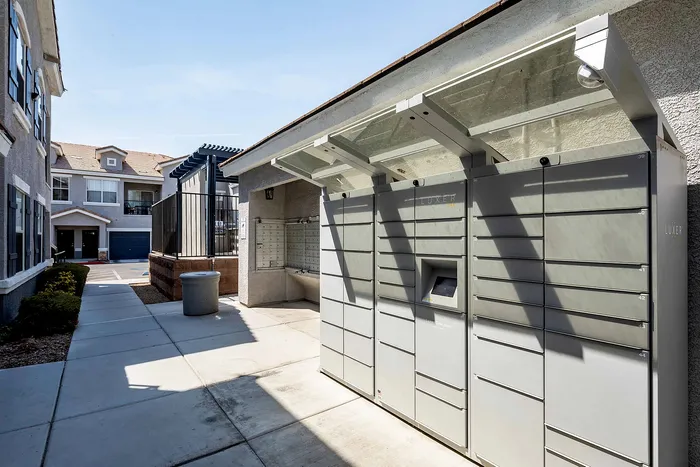 Contemporary outdoor package locker system in a residential complex, designed for convenience and security.