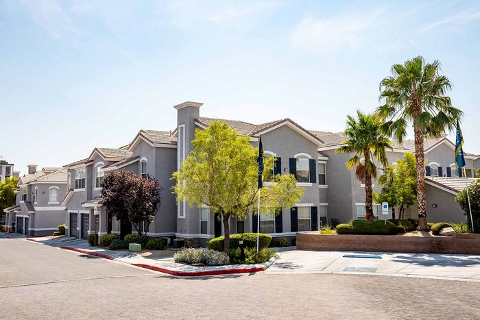 Charming suburban apartment complex with well-maintained landscaping and elegant architectural design.