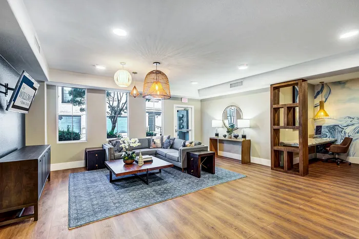 Beautifully designed living room with elegant decor and natural lighting, featuring a cozy seating area and stylish furniture.