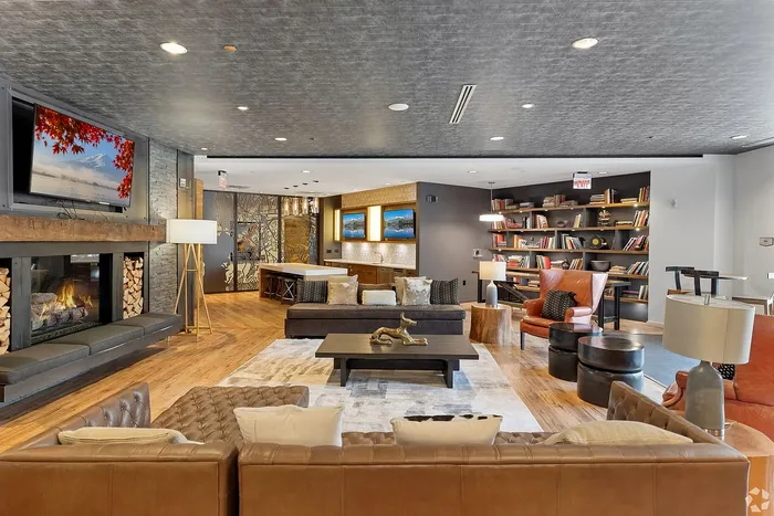 Inviting lounge with cozy fireplace, elegant seating, and stylish decor, perfect for relaxation and gathering.