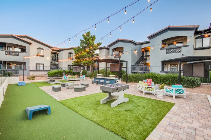 Estrella Gateway | Avondale, AZ | Outdoor Game Area at Dusk