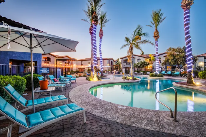 Estrella Gateway | Avondale, AZ | Resort Style Pool & Sun Deck at Dusk