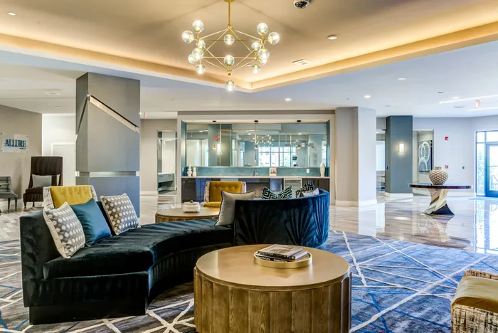 Luxurious apartment lounge featuring stylish modern decor, elegant lighting, and cozy seating areas.